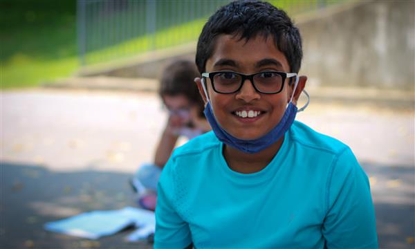 student smiles at camera